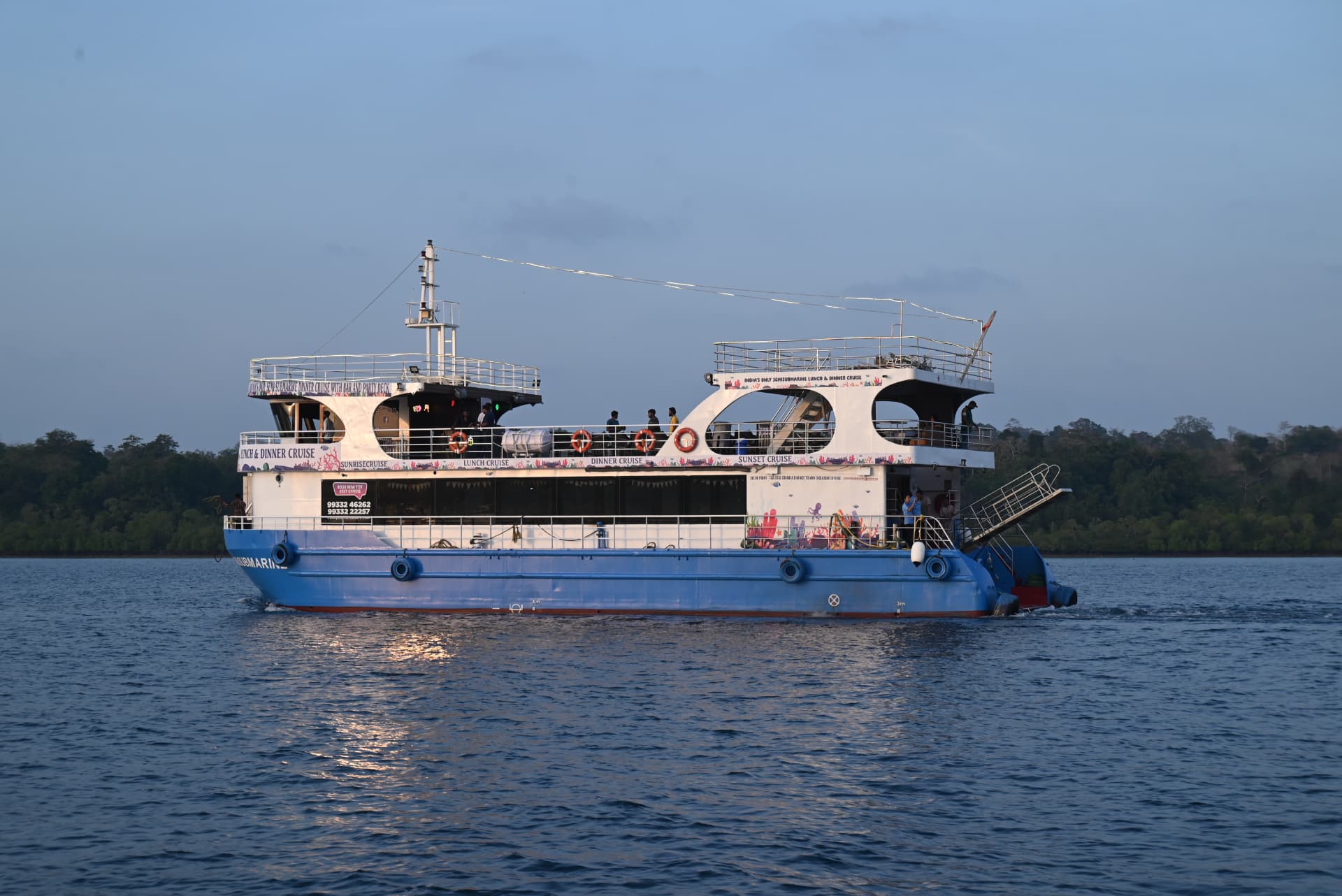The Canopus Marine semi-submarine cruising at dusk in the Andaman Islands