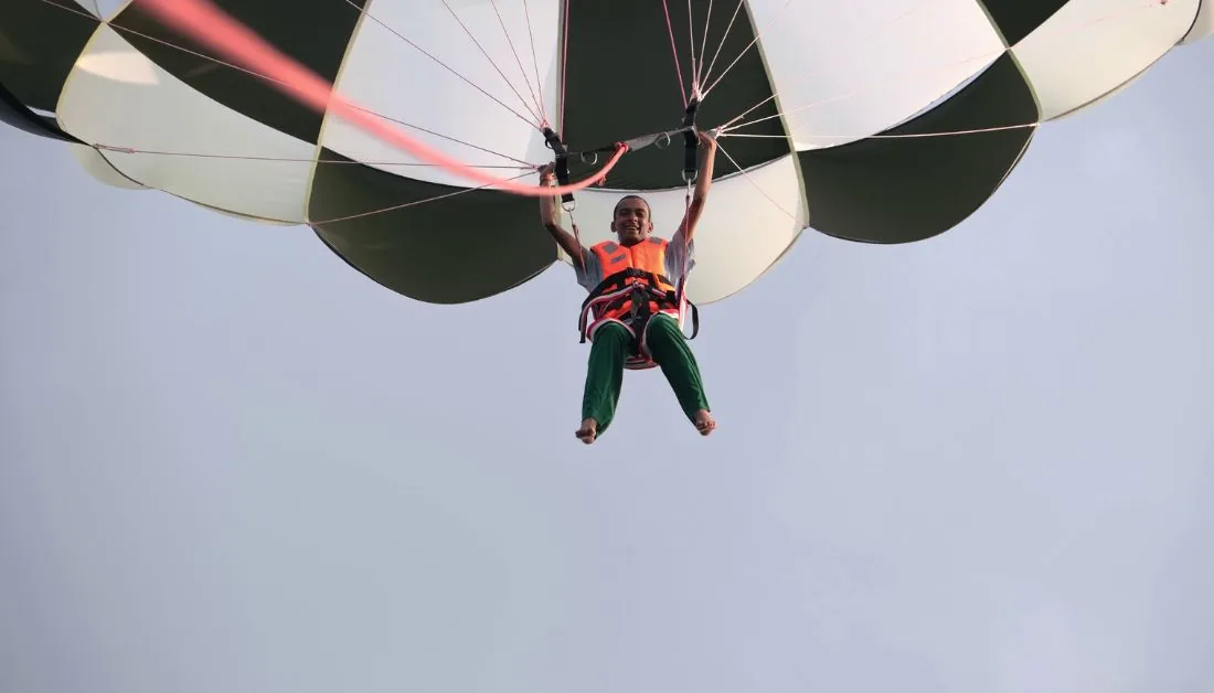Parasailing high above turquoise water on Havelock Island